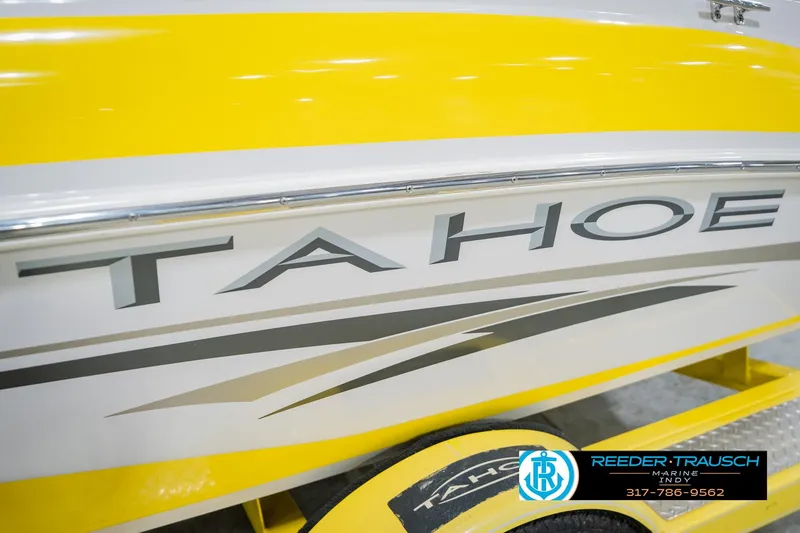 Slide: The Image of Yellow and white 2005 Tahoe Q4 boat with sleek design and branding. - 46