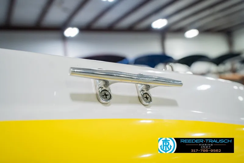 Slide: The Image of 2005 Tahoe Q4 boat cleat with yellow accent, Reeder Trausch Marine logo visible. - 53
