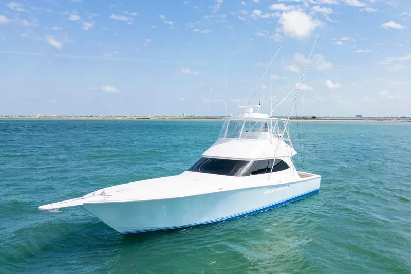 The Image of 2009 Viking 50 Convertible yacht on open water under a clear blue sky. - 0