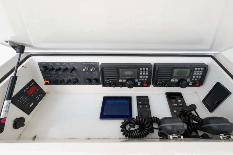 Slide: The Image of Control panel of a 2009 Viking 50 Convertible yacht with communication equipment. - 10