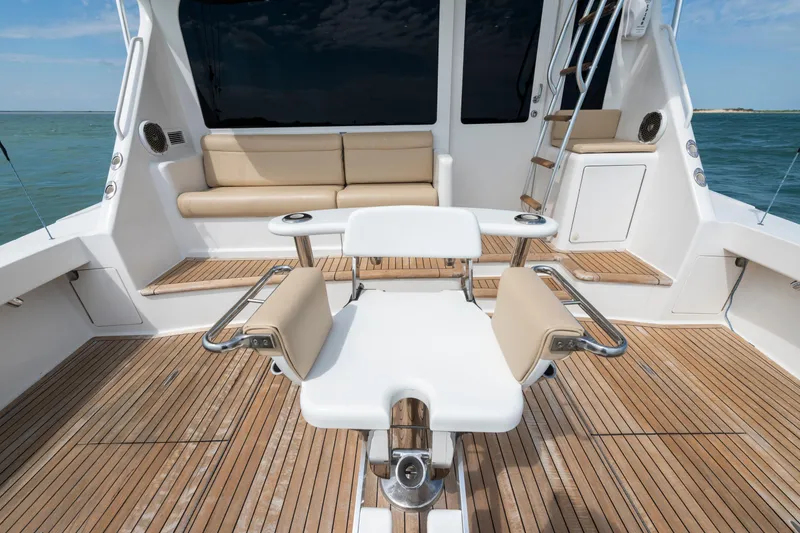 Slide: The Image of Luxurious 2009 Viking 50 Convertible yacht deck with seating and ocean view. - 14