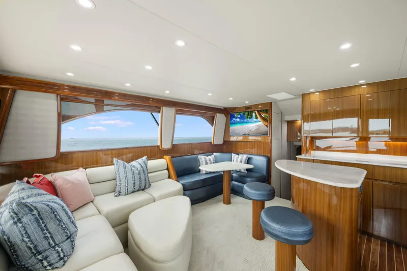 Slide: The Image of Luxurious interior of 2009 Viking 50 Convertible yacht with elegant seating and ocean view. - 16