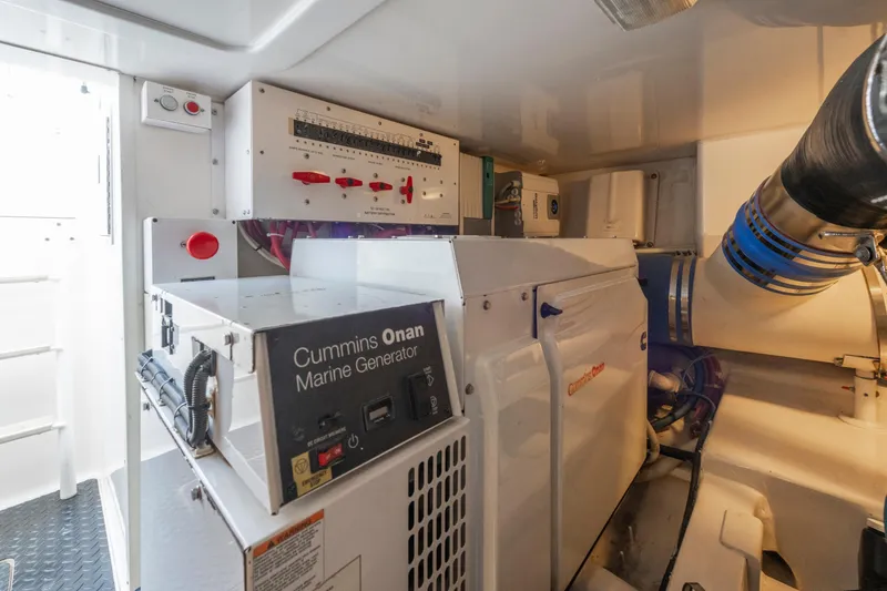 Slide: The Image of Engine room of 2009 Viking 50 Convertible with Cummins Onan marine generator. - 33