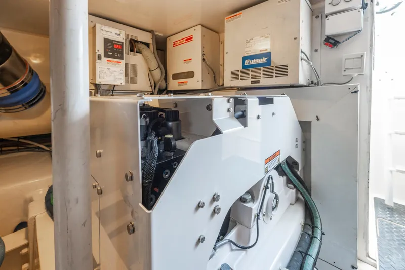 Slide: The Image of Engine room of 2009 Viking 50 Convertible yacht with mechanical equipment and wiring. - 34