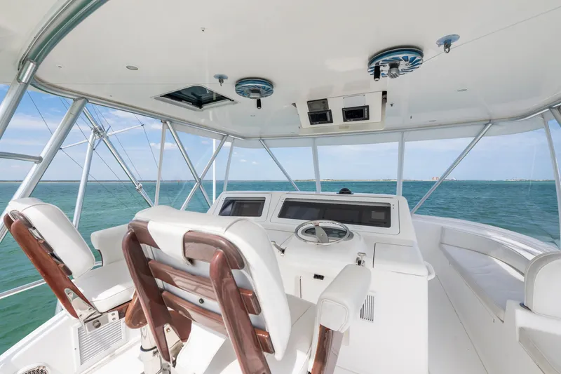 Slide: The Image of 2009 Viking 50 Convertible yacht helm with ocean view and modern controls. - 5