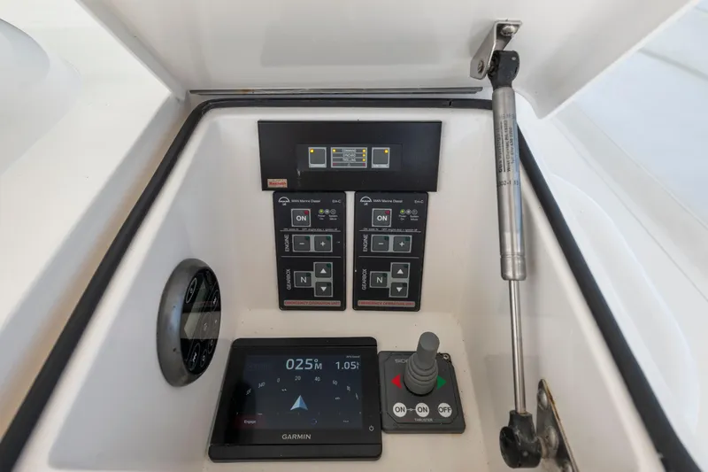 Slide: The Image of Control panel of a 2009 Viking 50 Convertible yacht with Garmin navigation display. - 9