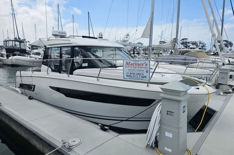 The Image of 2021 Jeanneau NC Weekender 895 docked at marina, available for sale. - 0