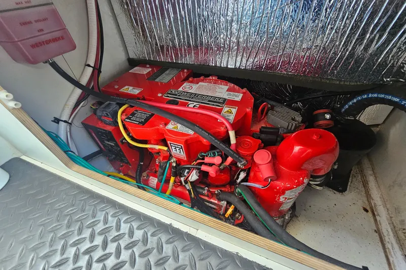 Slide: The Image of Engine compartment of 2021 Jeanneau NC Weekender 895 with Westerbeke generator. - 15