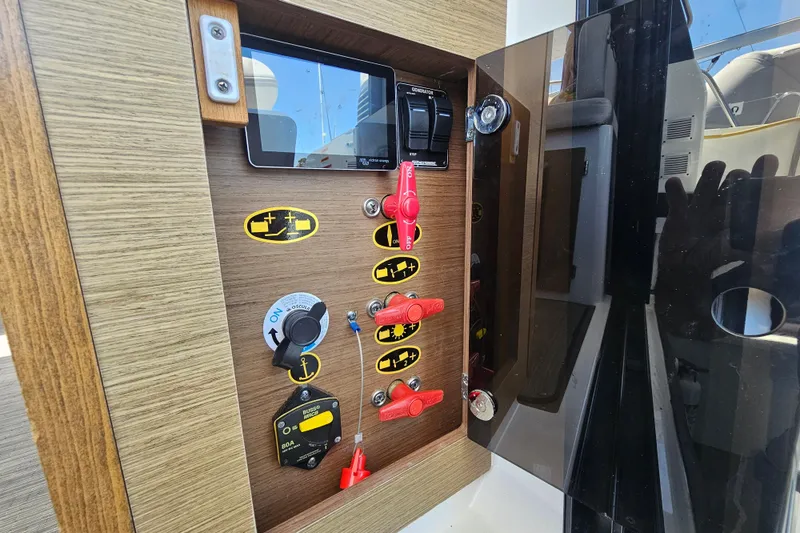 Slide: The Image of Control panel of 2021 Jeanneau NC Weekender 895 boat with switches and indicators. - 17