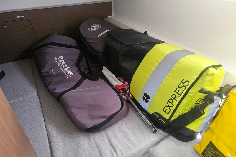 Slide: The Image of Storage area on a 2021 Jeanneau NC Weekender 895 with bags and equipment. - 25