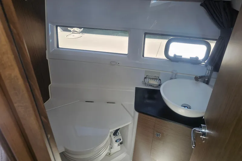 Slide: The Image of 2021 Jeanneau NC Weekender 895 bathroom with sink and toilet. - 31