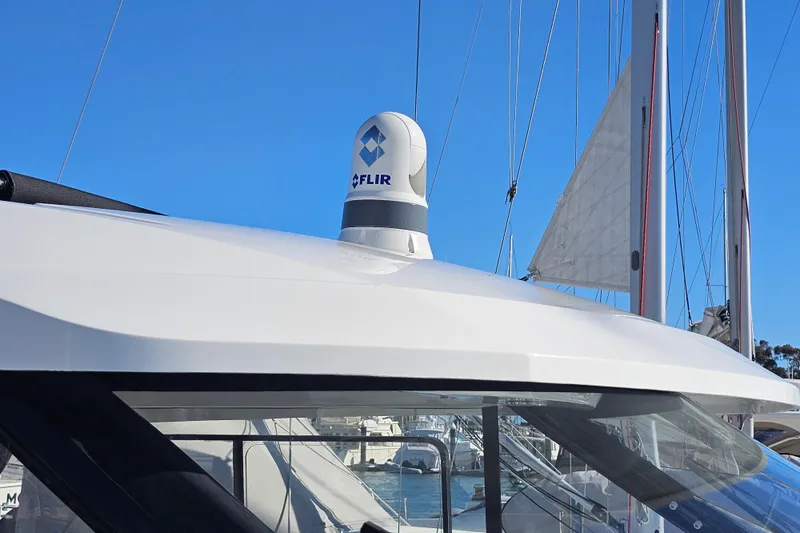 Slide: The Image of 2021 Jeanneau NC Weekender 895 with FLIR camera on roof, docked at marina. - 5