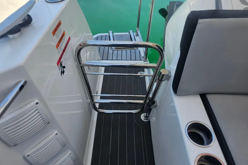Slide: The Image of Jeanneau NC Weekender 895, 2021 model, featuring a sleek deck with stainless steel railing. - 7