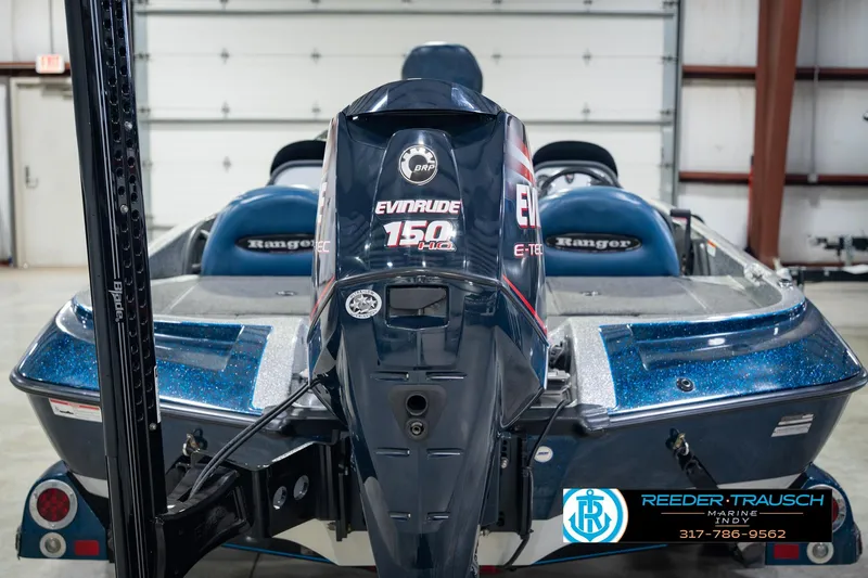 Slide: The Image of 2007 Ranger 188 VS boat with Evinrude 150 motor in a garage setting. - 11