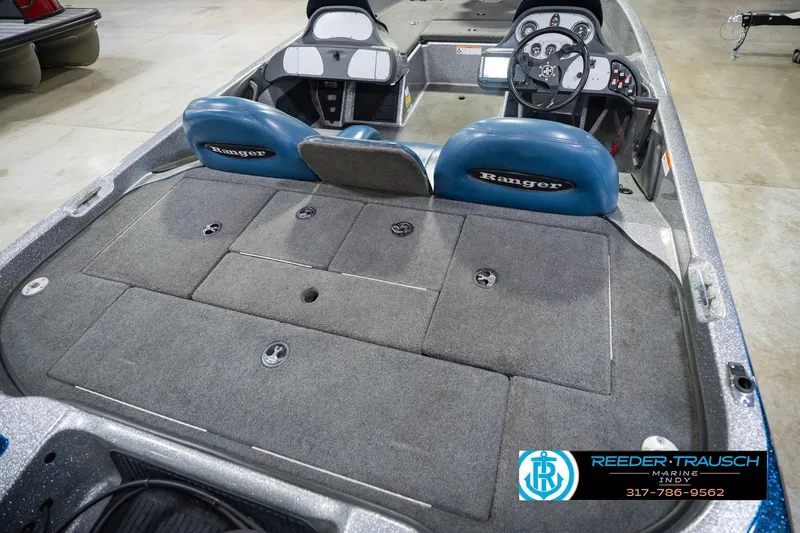 Slide: The Image of 2007 Ranger 188 VS boat interior with steering wheel and storage compartments. - 16