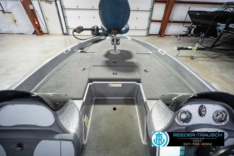 Slide: The Image of 2007 Ranger 188 VS boat interior with steering console and fishing seat in a showroom. - 19