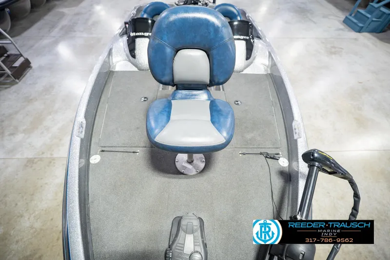 Slide: The Image of 2007 Ranger 188 VS boat interior with blue seat and fishing equipment. - 21
