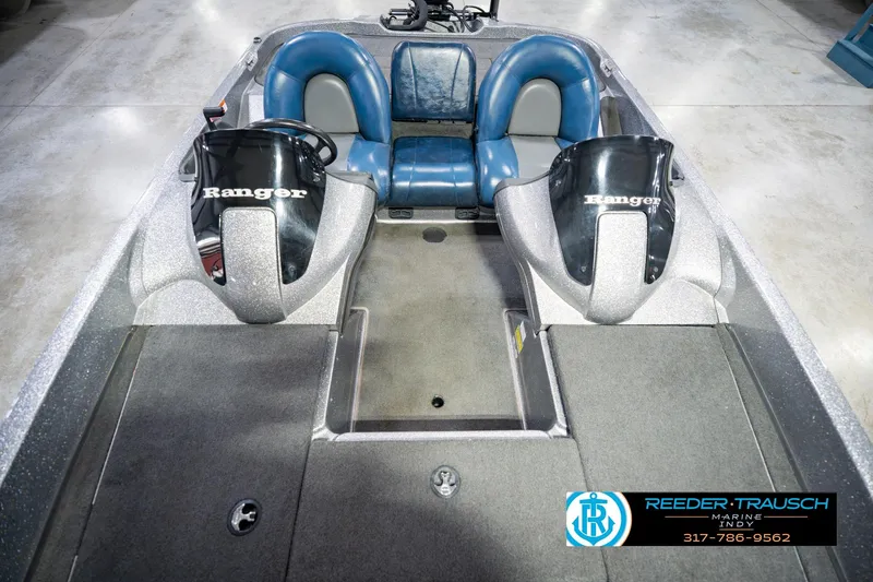 Slide: The Image of 2007 Ranger 188 VS boat interior with dual consoles and blue seating. - 22
