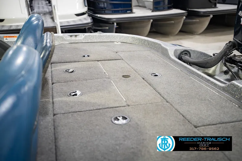 Slide: The Image of 2007 Ranger 188 VS boat interior with carpeted deck and storage compartments. - 24