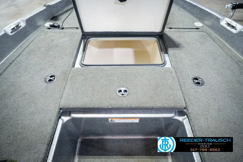 Slide: The Image of 2007 Ranger 188 VS boat interior with open storage compartment. - 28