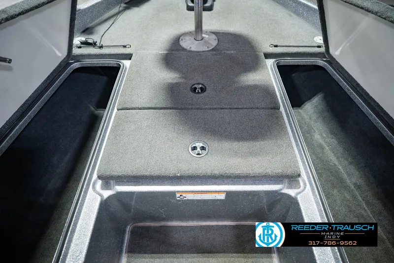 Slide: The Image of 2007 Ranger 188 VS boat interior with storage compartments and carpeted flooring. - 29