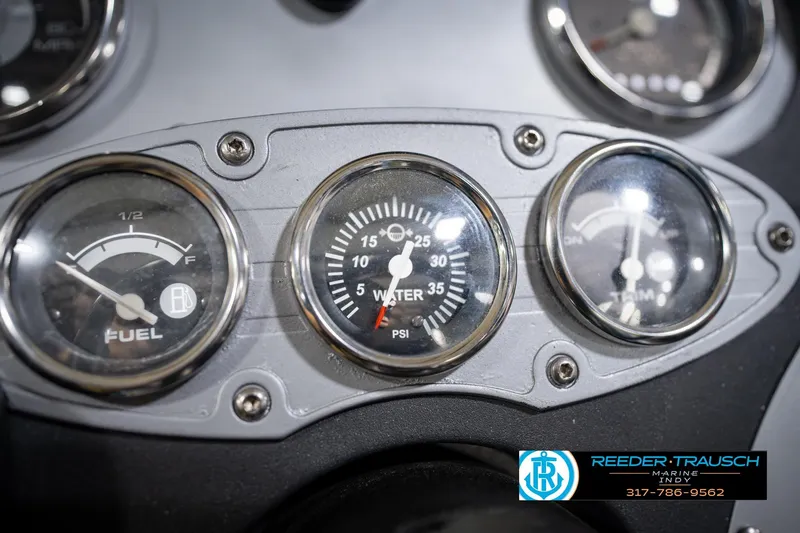 Slide: The Image of Dashboard gauges of a 2007 Ranger 188 VS boat, showing fuel and water pressure. - 35