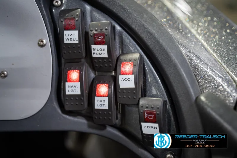 Slide: The Image of Control panel of a 2007 Ranger 188 VS boat with illuminated switches. - 39