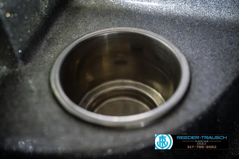 Slide: The Image of Close-up of a cup holder in a 2007 Ranger 188 VS boat. - 47