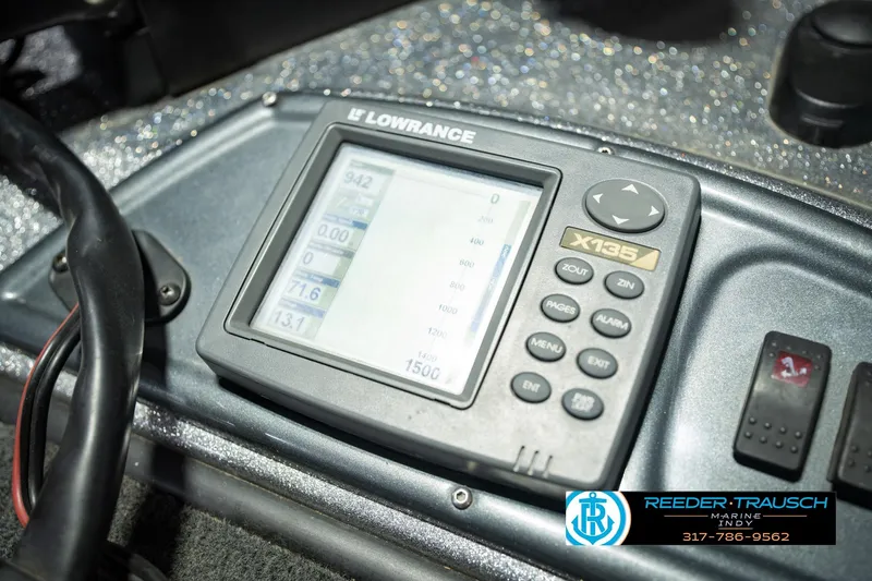 Slide: The Image of Lowrance X135 fishfinder on 2007 Ranger 188 VS boat dashboard, Reeder-Trausch Marine logo visible. - 48