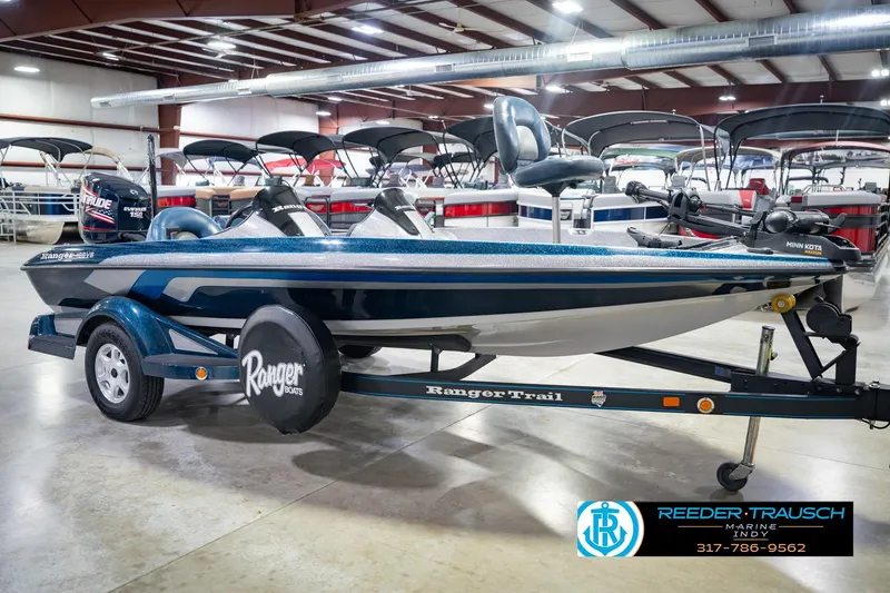 Slide: The Image of 2007 Ranger 188 VS boat on trailer in showroom, featuring Evinrude engine and Minn Kota trolling motor. - 8