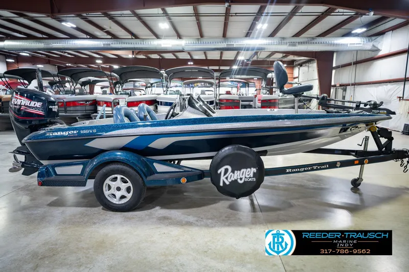 Slide: The Image of 2007 Ranger 188 VS boat in showroom, featuring Evinrude engine and Ranger Trail trailer. - 9