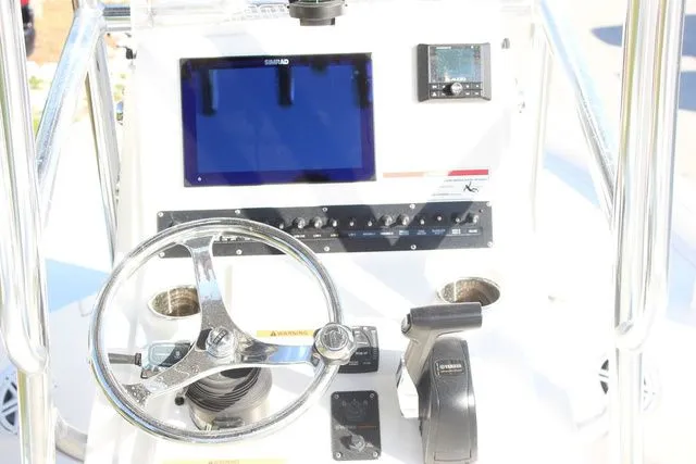 Slide: The Image of 2024 Pathfinder 2200 TRS helm with steering wheel and electronics. - 13