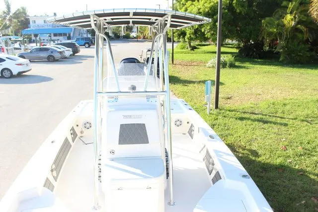 Slide: The Image of 2024 Pathfinder 2200 TRS boat with T-top in parking area. - 21