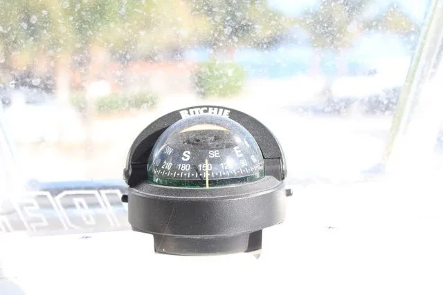 Slide: The Image of Compass on Pathfinder 2200 TRS boat, 2024 model. - 22