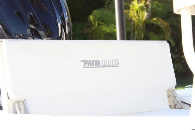 Slide: The Image of 2024 Pathfinder 2200 TRS boat with white seat and logo. - 26