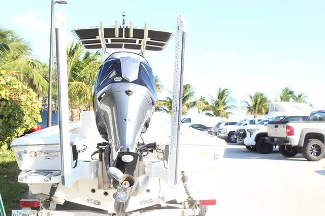 Slide: The Image of Rear view of a 2024 Pathfinder 2200 TRS boat with outboard motor. - 8