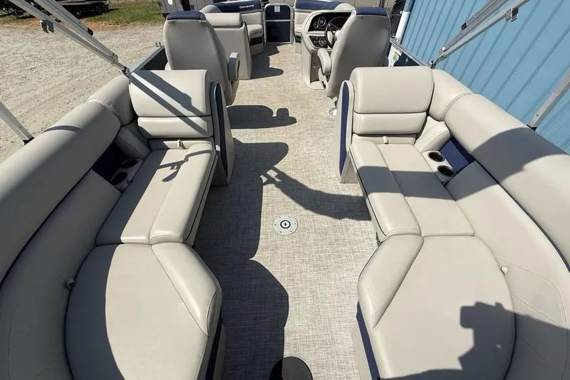 Slide: The Image of Luxurious seating on a 2022 Berkshire 24RFX LE pontoon boat with cup holders. - 13