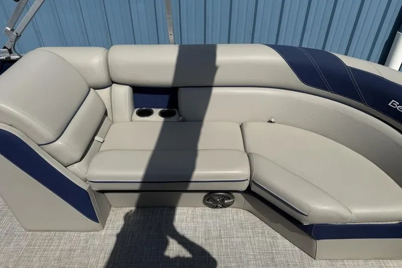 Slide: The Image of Storage compartment with cup holders in 2022 Berkshire 24RFX LE boat. - 15