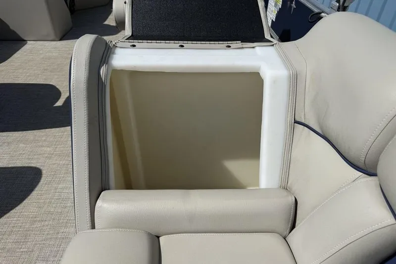 Slide: The Image of Storage compartment in 2022 Berkshire 24RFX LE boat, featuring seating and internal components. - 18