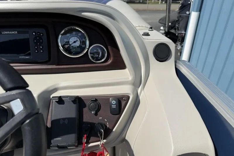 Slide: The Image of Dashboard of 2022 Berkshire 24RFX LE boat with gauges and controls. - 22