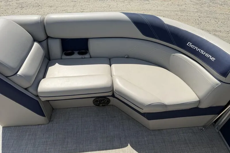 Slide: The Image of Luxurious seating on 2022 Berkshire 24RFX LE pontoon boat with cup holders and speaker. - 32