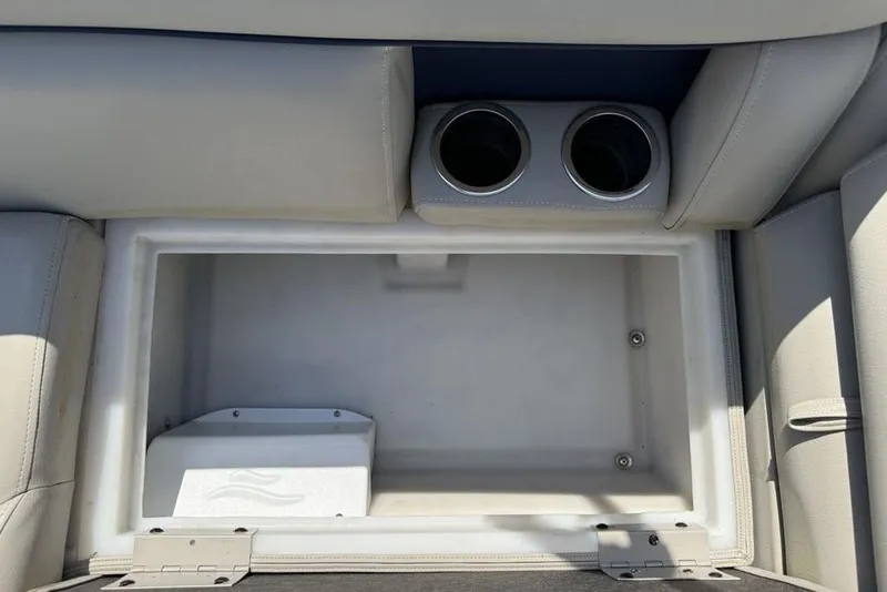Slide: The Image of Luxurious seating on 2022 Berkshire 24RFX LE pontoon boat with cup holders and blue accents. - 7