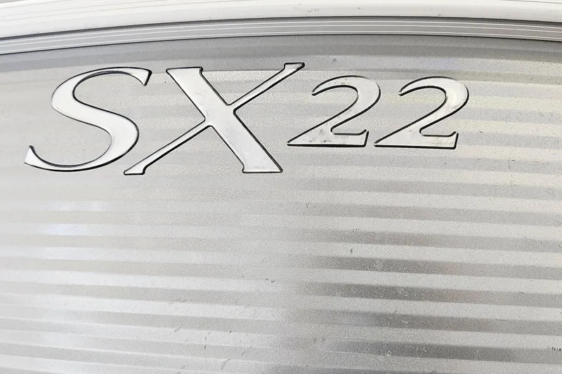 Slide: The Image of 2019 Bennington SX 22 Premium Stern Radius logo on metallic surface. - 18