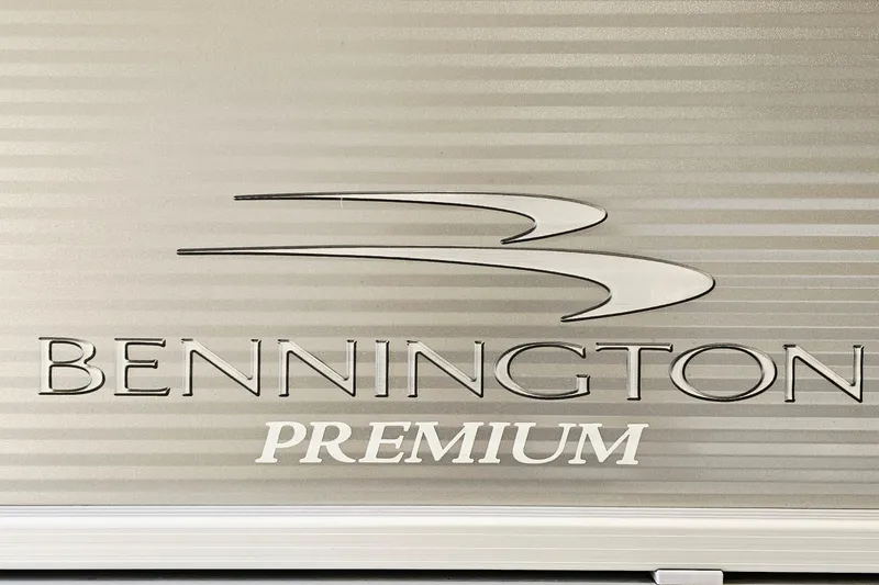 Slide: The Image of Bennington SX 22 Premium Stern Radius 2019 logo on metallic surface. - 19