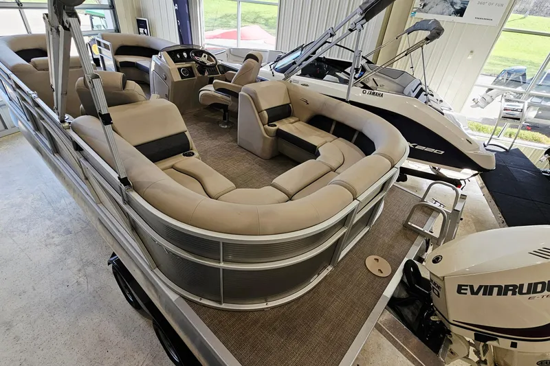 Slide: The Image of 2019 Bennington SX 22 Premium Stern Radius pontoon boat with spacious seating and Evinrude motor. - 4
