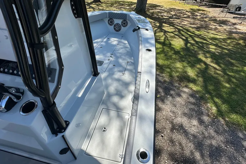 Slide: The Image of 2023 Latitude Tournament Boats LTB 25, docked outdoors under clear blue sky. - 10