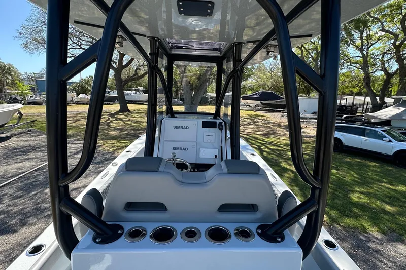 Slide: The Image of 2023 Latitude Tournament Boats LTB 25 deck with seating and rod holders. - 11