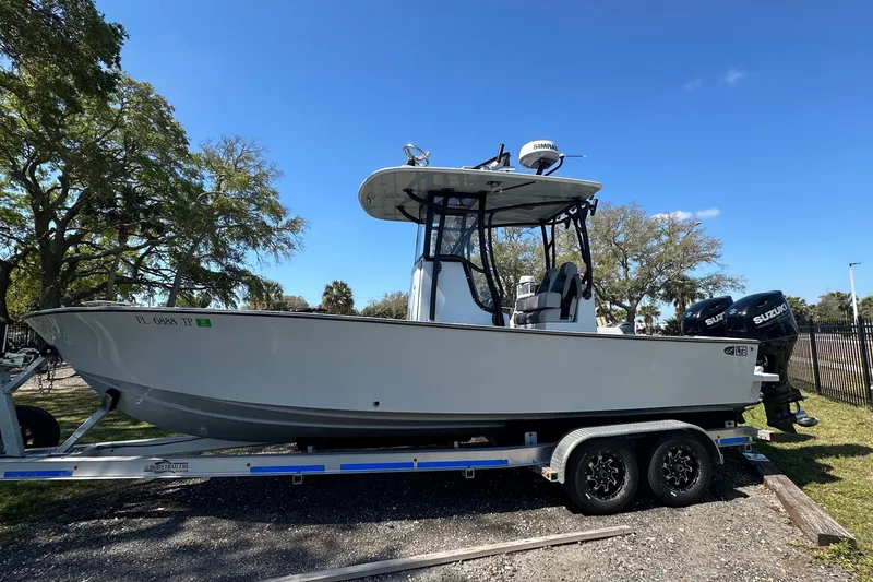 Slide: The Image of 2023 Latitude Tournament Boats LTB 25 with Suzuki outboard motor on trailer. - 5