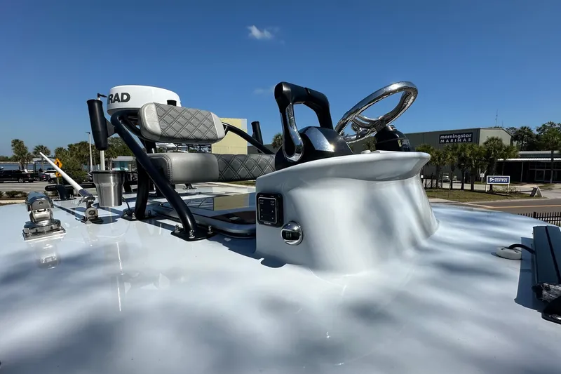 Slide: The Image of 2023 Latitude Tournament Boats LTB 25 cockpit with dual seats and steering wheel. - 8