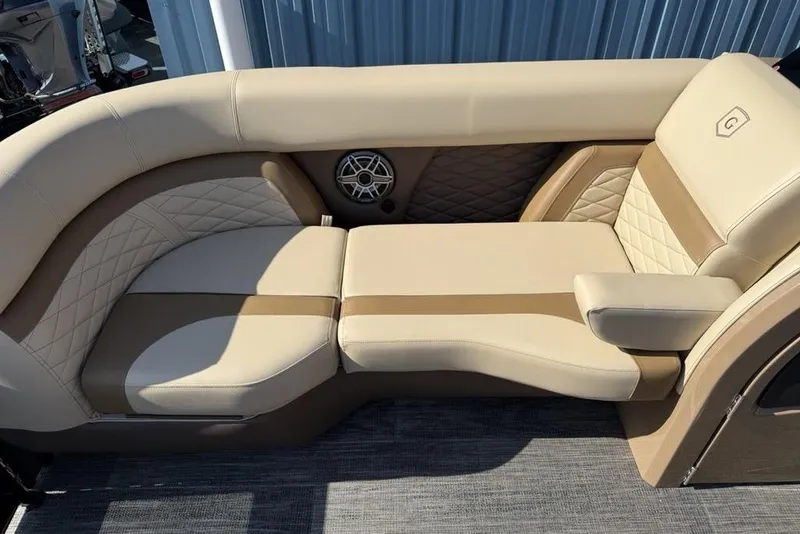 Slide: The Image of Luxurious seating on 2026 Godfrey Monaco 235 SB boat, featuring beige upholstery and stylish design. - 10